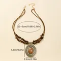 Bohemian layered turquoise bead necklace with antique bronze hollow pendant and size details - Coffee