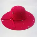 Detailed view of magenta wool fedora hat with white pearls and gold bead embellishments - Rose Red