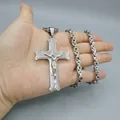 Macro shot of silver stainless steel cross pendant with detailed crucifix and thick chain - Cross Pendant with Byzantine Chain / Steel