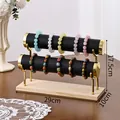 Double-tier jewelry display stand with black velvet cylinders and gold metal supports - Double Layer / Black Leather