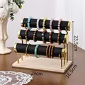Three-tier black PU leather jewelry stand with gold metal frame and wooden base - Triple Layer / Black Leather