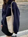 Σκούρο μπλε oversized φούτερ με γιακά πόλο, φερμουάρ και κέντημα Jazz Corner - S / Ναυτικό μπλε