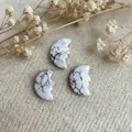 Three white howlite crescent moon face pendants with natural grey marble textures - White Turquoise