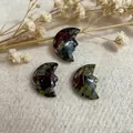Hand-carved natural bloodstone crescent moon face pendant with deep green and red texture - Dragon Blood Stone
