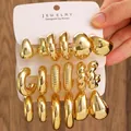 Polished gold multi-style C-shaped hoop earrings set on white display card - 18-Pair Gold Geometric Large Earrings Set / Gold (3 Cards)