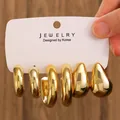 Three-pair gold-plated chunky C-shape hoop and teardrop earrings set on display card - 3-Pair Gold Polished Chunky Hoop Earrings / Gold (WG-0988)