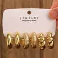Three-pair gold hoop earring set with smooth, ribbed, and braided textures on white card - 3-Pair Gold Threaded Twisted Hoop Earrings / Gold (H-100)