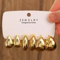 Three-pair gold C-shaped earring set with teardrop and hoop designs on white display card - 3-Pair Gold Teardrop Polished Earrings Set / Gold (H-101)