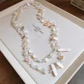 Elegante collana a doppio strato con pezzi di conchiglia naturale e perle di cristallo - Collana N. 47 - Bianco Sporco