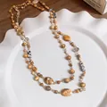 Collana a doppio strato in acciaio inossidabile con perle in vetro dai toni naturali - 52# Collana-Oro-Caffè