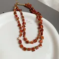 Elegante collana a due fili con perle di vetro arancioni e dettagli dorati - 66# Collana-Caffè