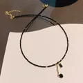 Elegante collana in acciaio inossidabile con perle nere e pendenti dorati, SKU - Collana 76# - Nera