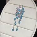Elegant long dangle earrings featuring light blue cat's eye beads and sparkling crystals - 30# Silver Needle -- Silver-blue