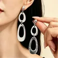 Minimalist silver oval drop earrings with polished metallic finish for women - Silver Double Oval Hollow Earrings (10387)