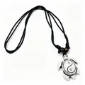 Detail view of the vintage resin turtle pendant necklace featuring a Tai Chi Yin Yang symbol. - White