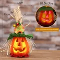 Zucca di Halloween luminosa in schiuma con cappello verde e girasoli, altezza 22cm - Zucca con Cappello Verde