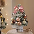 Mini snowy Christmas tree with pink ribbons, pine cones and Merry Christmas sign - British Flocked Pink Mini Tree 30cm