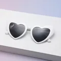 White heart-shaped sunglasses with dark grey lenses and Bride text on the lens - C16