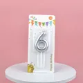 Detailed view of a silver number 6 birthday cake candle in retail blister card packaging - Silver Number 6 Candle