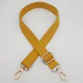 Detail of adjustable yellow canvas bag strap with gold metal lobster clasps and buckles - Silver Hook / Yellow