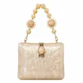 Detail of creamy white acrylic box clutch with pearl texture and gold hardware clasp - Champagne Marble