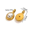 Detailweergave van de ovale gouden hanger met gefacetteerde edelsteen en afmetingen - Gouden Ovale Hanger - Witte Zirconia