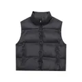 Gilet matelassé noir brillant avec col montant et poches zippées pour femmes - XS / Noir