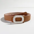 Macro shot of 2.8cm brown leather belt featuring pearl and rhinestone buckle - Camel