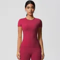 Detail of high-stretch magenta yoga set featuring a slim-fit tee and high-waist compression leggings - 7103 Short-sleeved T-shirt - Rouge Red / S