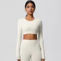 Women's two-piece ivory yoga set with long sleeve crop top and high waist leggings - 7104 Long Sleeve - Light Ivory / S
