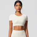 Women's creamy white yoga set featuring short sleeve crop top and high waist leggings - 7105 Short Sleeve - Light Ivory / S