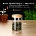 A 575ML glass storage jar with bamboo lid for tea leaves, measuring 8.5x12cm in size - Diameter 8.5 Cm * Height 12 Cm * Capacity Approximately 575 Ml / Clear