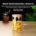 1000ML transparent glass storage jar with bamboo lid and dried chrysanthemum flowers - 10cm In Diameter * 15cm In Height * Approximately 1000ml In Capacity / Clear