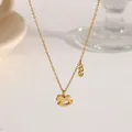 Gold titanium rocking horse necklace with a dollar sign pendant in minimalist style - Dollar Sign Horse (XKN0247)