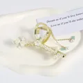 Pince à cheveux élégante en métal doré avec fleurs de muguet et pampilles de perles - Muguet Perle Gland
