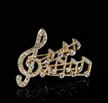 Elegant gold musical G-clef brooch with sparkling rhinestones on black background - Large Linked G-Clef Gold (XD825417-1)