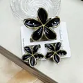 Three-piece black frangipani hair claw and earrings set with gold-tone edges - Black Set With Gold-rimmed Buckles (including Card)