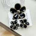 Elegant black and gold plumeria hair claw clip with matching stud earrings set - Gold-rimmed Five-petal Flower Clasp Black Set (including Card)