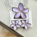 Set of three purple plumeria hair claws with gold edges on a fashion display card - Purple Set With Gold-rimmed Buckles (including Cards)