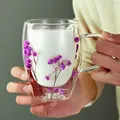 Double-walled glass mug with handle featuring purple dried flowers inside the layer - Purple Star Tree