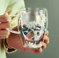 Double-walled borosilicate glass mug with integrated handle and white dried flowers - Blue Enchantress