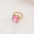 Adjustable golden ring with a square pink gemstone surrounded by white crystals - 3005 Pink Ring