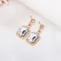 Elegant gold drop earrings with rectangular clear gemstones and pave detail - White Stud Earrings (3085)