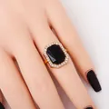 Vintage gold ring featuring a large octagonal black gemstone surrounded by white rhinestones - 3002 Black Ring