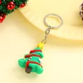 Green PVC Christmas tree keychain with red accents and gold star on a warm background - Christmas Tree Design Two (silver Keychain) / Approximately 3.8-5.6cm High And 2.6-3.8cm Wide.