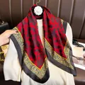 Leopard print silk scarf with red floral center and yellow border on a white sweater - 70cmx70cm / Red Leopard