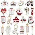 Variety of 19 medical-themed enamel charms including stethoscope and syringe shapes - Mixed 20 Drops Of Red And White Medical Oil - 1 Of Each Of The 20 Types - 36.05g - Sn1714 / Oil Dripping Medical Equipment Accessories