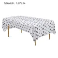 Detail of disposable PEVA tablecloth with black paw print pattern, 1.37x2.74m - Paw Print Style
