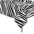 Detail of disposable PEVA tablecloth with black and white zebra stripes for party decor - Zebra Style