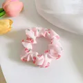 Pink scrunchie with red cherry patterns on mesh fabric for stylish hair styling - Graphic Print / Pink Peach Print